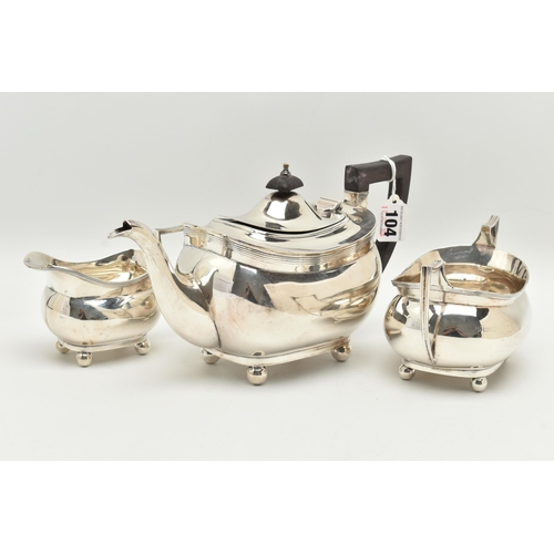 104 - A GEORGE V SILVER THREE PIECE TEA SET, comprising of a teapot, milk jug and double handled sugar bow... 