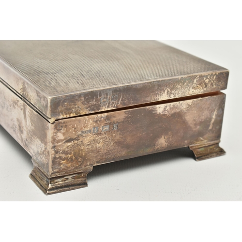 105 - A SILVER CIGARETTE BOX, of a rectangular form, engine turned pattern with personal engraving to the ... 