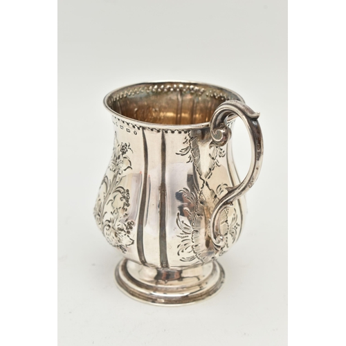 107 - A MID VICTORIAN SILVER CHRISTENING MUG, the bulbous outline embossed with foliate decoration and eng... 