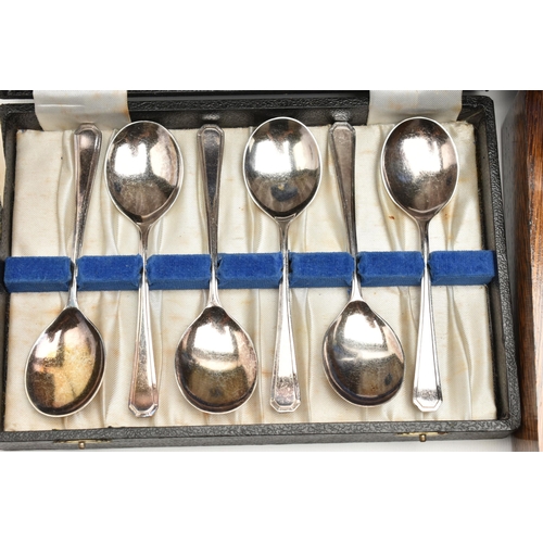 129 - A BOX OF ASSORTED WHITE METAL WARE, to include a small wooden canteen with mixed cutlery, teapots, c... 