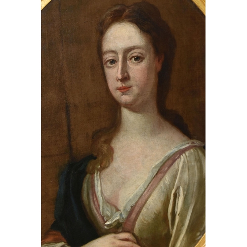 322 - MANNER OF GODFREY KNELLER, an 18th century bust length portrait of a lady, posed against a column wi... 