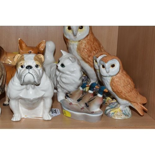 332 - A COLLECTION OF BESWICK ANIMALS, comprising a large owl model No. 1045, two small owls, model No. 20... 