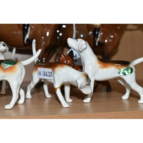 334 - A GROUP OF BESWICK FOX HUNTING FIGURES, comprising 'Huntsman Standing', model 1501, together with a ... 