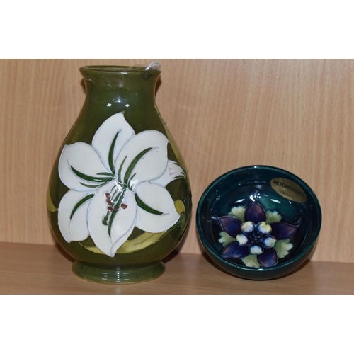 344 - TWO PIECES OF MOORCROFT POTTERY, comprising a Bermuda Lily baluster vase, tube lined with white lily... 