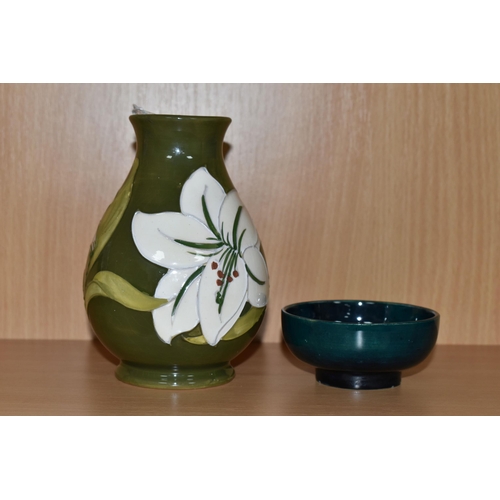 344 - TWO PIECES OF MOORCROFT POTTERY, comprising a Bermuda Lily baluster vase, tube lined with white lily... 