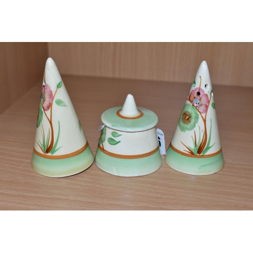 356 - A CLARICE CLIFF CONICAL CRUET SET, painted with tan trees of pink and green flowers, with green and ... 