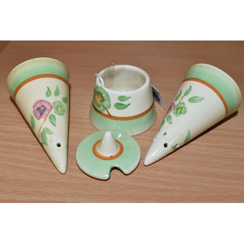 356 - A CLARICE CLIFF CONICAL CRUET SET, painted with tan trees of pink and green flowers, with green and ... 