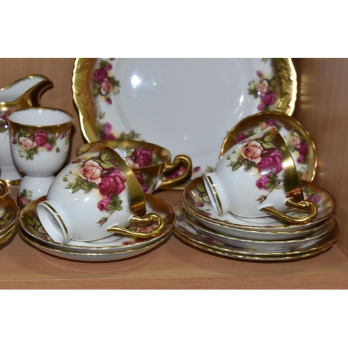 360 - A TWENTY FIVE PIECE ROYAL CHELSEA 'GOLDEN ROSE' TEA SET, comprising a cake plate, a sugar bowl, a pr... 