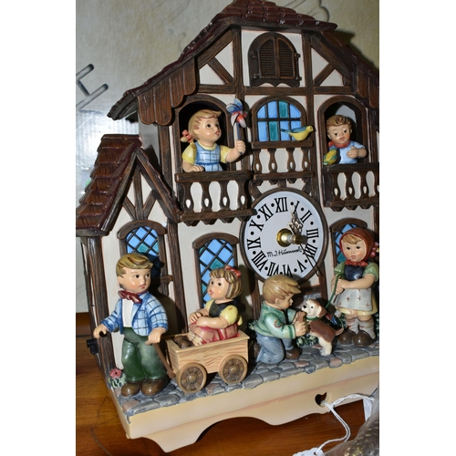 370 - A BOXED HUMMEL CUCKOO CLOCK, by Danbury Mint, depicting seven characters in and around a Bavarian st... 