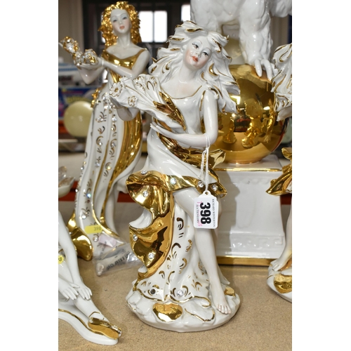 398 - A CAPODIMONTE FIGURINE SET consisting of white porcelain figurines with gilded and embellished featu... 