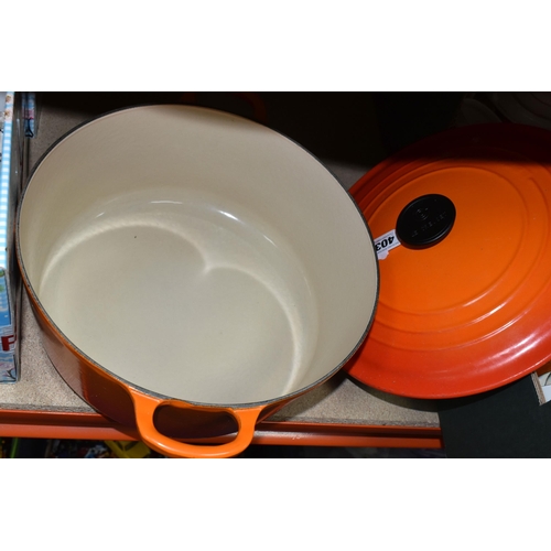 403 - A LARGE ORANGE LE CREUSET 28cm CASSEROLE POT in fair condition with lid (1)