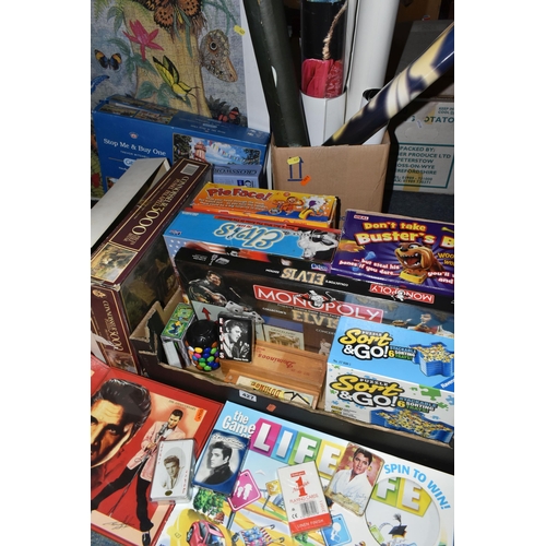 427 - TWO BOXES AND LOOSE GAMES, JIGSAWS AND POSTERS to include a large number of Elvis themed games and p... 