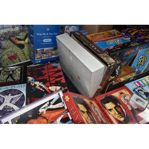 427 - TWO BOXES AND LOOSE GAMES, JIGSAWS AND POSTERS to include a large number of Elvis themed games and p... 