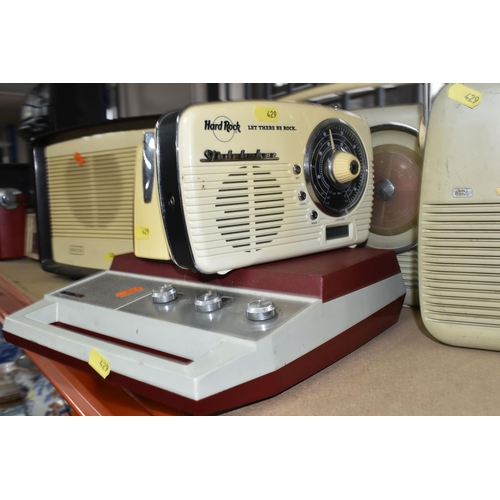 429 - A LARGE QUANTITY OF VINTAGE RADIOS, comprising three Bush portable FM radios, a TR130 Bush portable ... 