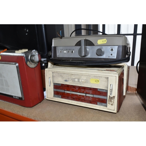 429 - A LARGE QUANTITY OF VINTAGE RADIOS, comprising three Bush portable FM radios, a TR130 Bush portable ... 