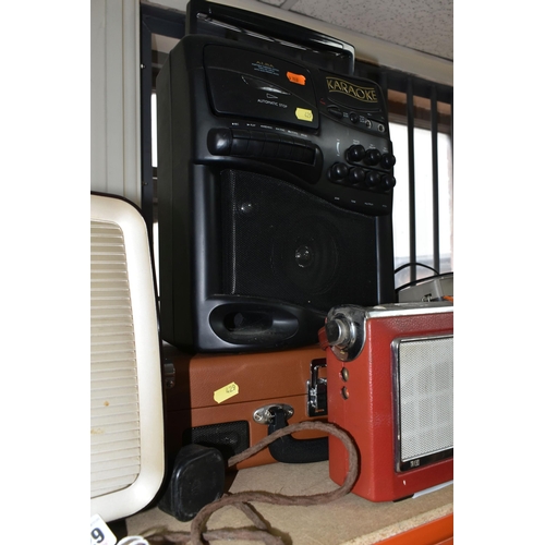 429 - A LARGE QUANTITY OF VINTAGE RADIOS, comprising three Bush portable FM radios, a TR130 Bush portable ... 