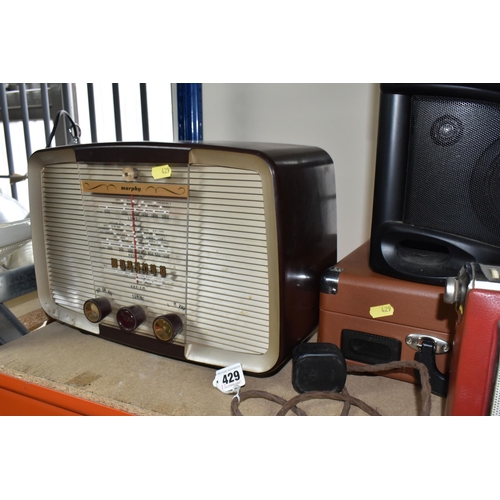 429 - A LARGE QUANTITY OF VINTAGE RADIOS, comprising three Bush portable FM radios, a TR130 Bush portable ... 