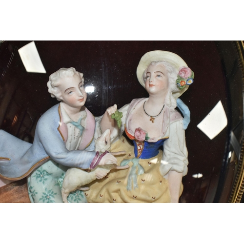 458 - A PAIR OF FRAMED AND GLAZED RELIEF PORCELAIN FIGURE GROUPS, each depicting a courting couple, mounte... 