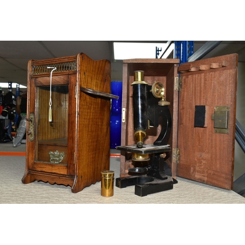 467 - A VICTORIAN MICROSCOPE AND AN OAK SMOKER'S CABINET, comprising a wooden cased microscope with two le... 