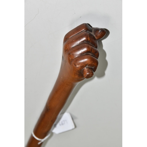 545 - A WOODEN SWAGGER STICK WITH CARVED CLENCHED FIST TERMINAL, approximate length 45cm (1)