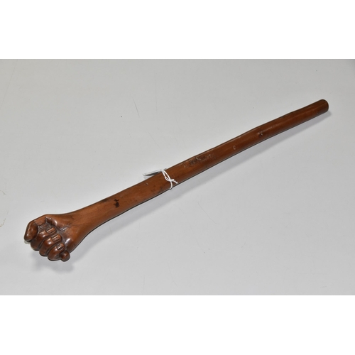 545 - A WOODEN SWAGGER STICK WITH CARVED CLENCHED FIST TERMINAL, approximate length 45cm (1)