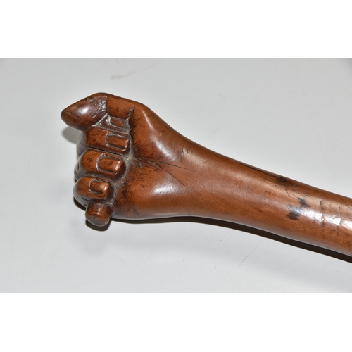 545 - A WOODEN SWAGGER STICK WITH CARVED CLENCHED FIST TERMINAL, approximate length 45cm (1)