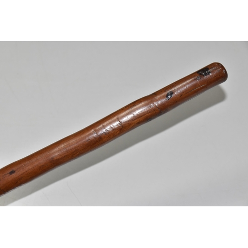 545 - A WOODEN SWAGGER STICK WITH CARVED CLENCHED FIST TERMINAL, approximate length 45cm (1)