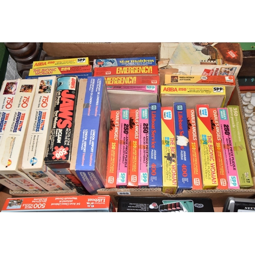 555 - TWO BOXES AND LOOSE OF JIGSAW PUZZLES AND GAMES, including marble effect chess set, Retro pin footba... 