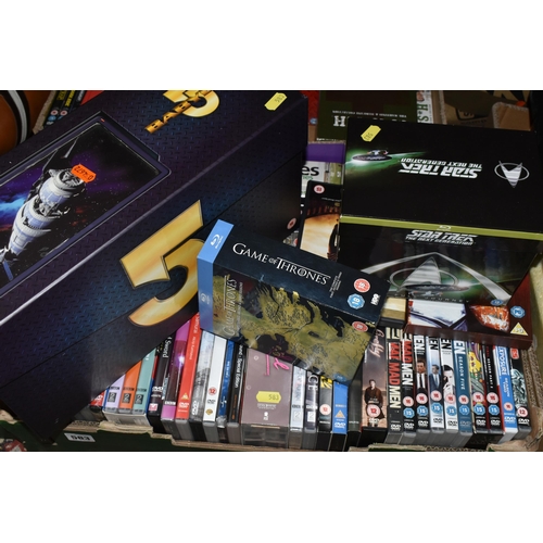 583 - FOUR BOXES AND LOOSE DVDs AND CDs, including The Ultimate Babylon 5 Collection in a presentation box... 