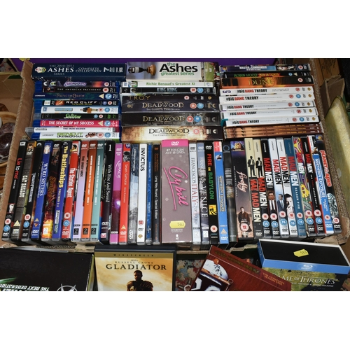 583 - FOUR BOXES AND LOOSE DVDs AND CDs, including The Ultimate Babylon 5 Collection in a presentation box... 