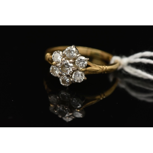 142 - AN 18CT GOLD DIAMOND CLUSTER RING, designed as a cluster of brilliant cut diamonds in claw settings,... 