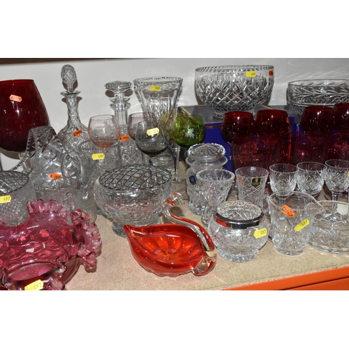 497 - A LARGE QUANTITY OF CLEAR AND COLOURED GLASS, to include four Edinburgh International glass bowls in... 