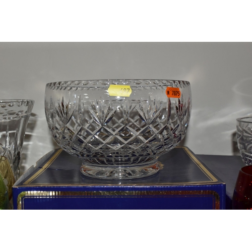 497 - A LARGE QUANTITY OF CLEAR AND COLOURED GLASS, to include four Edinburgh International glass bowls in... 