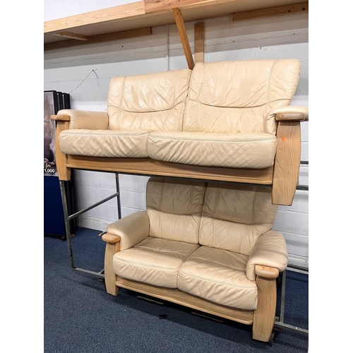 1363 - A LIGHT OAK AND CREAM UPHOLSTERED TWO PIECE LOUNGE SUITE, comprising a three seater settee, width 18... 