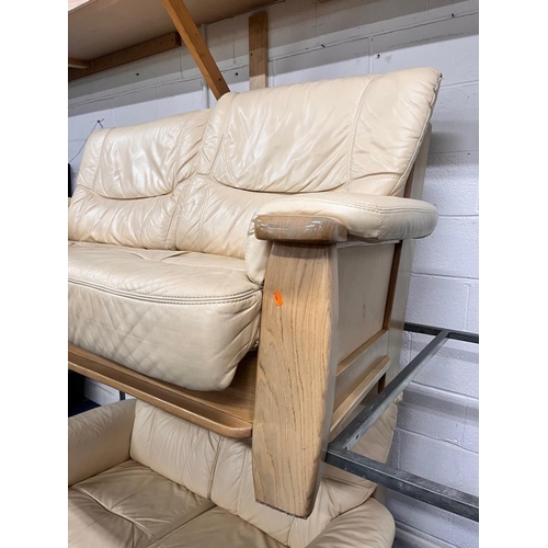 1363 - A LIGHT OAK AND CREAM UPHOLSTERED TWO PIECE LOUNGE SUITE, comprising a three seater settee, width 18... 