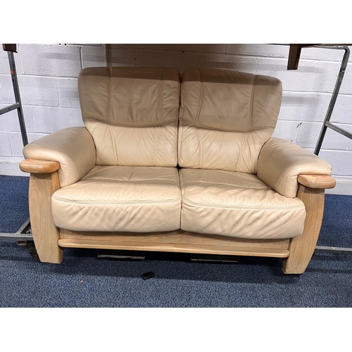 1363 - A LIGHT OAK AND CREAM UPHOLSTERED TWO PIECE LOUNGE SUITE, comprising a three seater settee, width 18... 