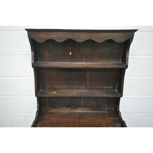 1199 - A REPRODUCTION GEORGIAN STYLE OAK DRESSER, of small proportions, the two tier plate rack, atop a bas... 