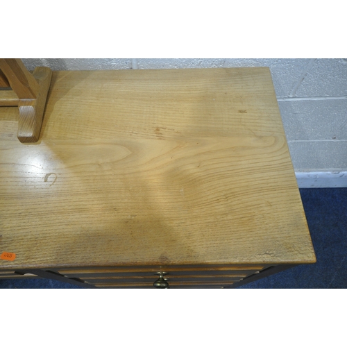 1200 - A GOOD QUALITY SOLID OAK DRESSING TABLE, fitted with nine assorted drawers, width 152cm x depth 49cm... 