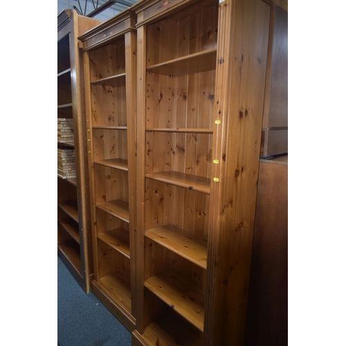 1349 - A PAIR OF PINE OPEN BOOKCASES, with an arrangement of shelving, width 66cm x depth 30cm x height 197... 