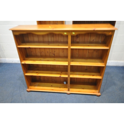 1373 - THREE PINE OPEN BOOKCASES, with an arrangement of shelving, stained bookcase width 86cm x depth 34cm... 