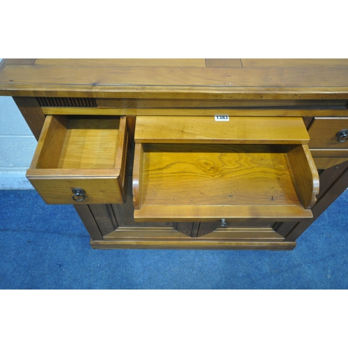 1383 - A MODERN CHERRYWOOD CABINET, with a hidden revolving pen tidy, three drawers and double cupboard doo... 