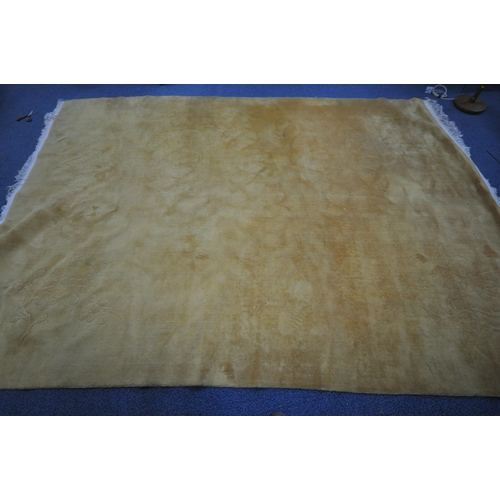 1384 - A MUSTARD YELLOW CHINESE RUG, 346cm x 247cm (condition report: discoloured and dirty)