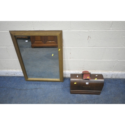 1385 - A 20TH CENTURY OAK CASED SINGER SEWING MACHINE, along with a rectangular wall mirror (condition repo... 