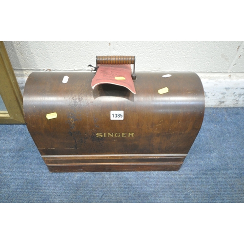 1385 - A 20TH CENTURY OAK CASED SINGER SEWING MACHINE, along with a rectangular wall mirror (condition repo... 