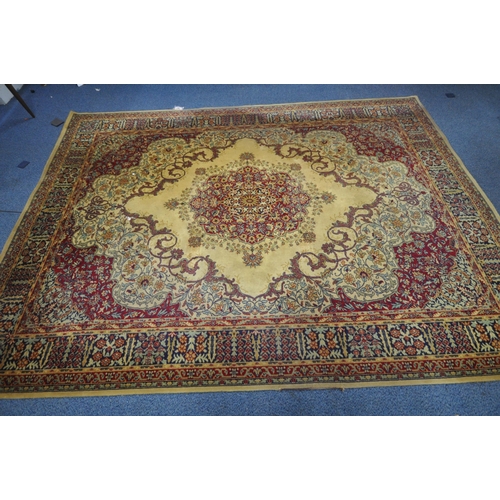 1386 - A MACHINE WOVEN PATTERNED RUG, with a central medallion and multi strap border, 320cm x 229cm (condi... 