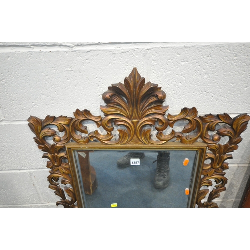 1387 - A FLAMBOYANT GILT FRAMED BEVELLED EDGE WALL MIRROR, 65cm x 102cm, along with a larger mahogany frame... 