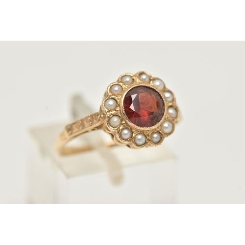 10 - A YELLOW METAL GARNET AND SPLIT PEARL CLUSTER RING, of a circular form set with a central circular c... 