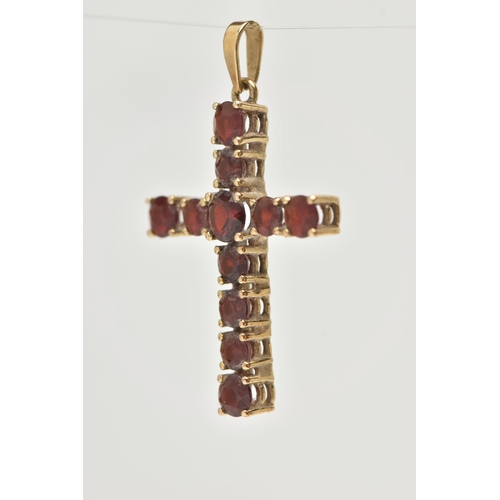 12 - A 9CT GOLD GARNET SET CROSS PENDANT, set with circular cut garnets, fitted with a tapered bail, hall... 