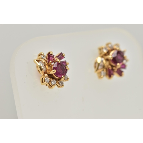 18 - A PAIR OF YELLOW METAL RUBY AND DIAMOND EARRINGS, each designed as a cluster set with a central circ... 