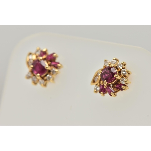 18 - A PAIR OF YELLOW METAL RUBY AND DIAMOND EARRINGS, each designed as a cluster set with a central circ... 